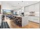 Open-concept kitchen with island, modern appliances, and sleek cabinets flows into the living area at 1901 Wazee St # 504, Denver, CO 80202