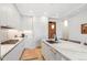 Modern kitchen with quartz countertops, white cabinets, stainless steel appliances, and hardwood floors at 1901 Wazee St # 504, Denver, CO 80202