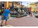 Outdoor seating area at Tom's Watch Bar with guests playing cornhole in a vibrant setting at 1901 Wazee St # 504, Denver, CO 80202