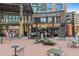 Outdoor seating area at Tom's Watch Bar with casual dining and street views at 1901 Wazee St # 504, Denver, CO 80202