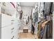 A well-organized walk-in closet with custom shelves and drawers provides ample storage and a light hardwood floor at 1901 Wazee St # 504, Denver, CO 80202