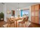 Bright dining room with table, chairs, and built-in cabinets at 51 W 6Th Pl, Byers, CO 80103