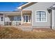 Charming front entrance with a covered porch, stylish door, and well-maintained landscaping at 51 W 6Th Pl, Byers, CO 80103