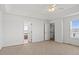 Spacious main bedroom with plush carpet, ceiling fan, and natural light at 51 W 6Th Pl, Byers, CO 80103