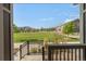 View of grassy common area from back porch at 14063 Jackson St, Thornton, CO 80602