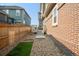 Small backyard with a wooden fence and gravel ground at 14063 Jackson St, Thornton, CO 80602