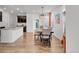 Kitchen and dining area with dark brown cabinets at 14063 Jackson St, Thornton, CO 80602