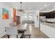 Open concept dining area with kitchen and living room views at 14063 Jackson St, Thornton, CO 80602