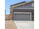 Attached two-car garage with gray doors at 14063 Jackson St, Thornton, CO 80602