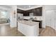 Modern kitchen with granite countertops and island at 14063 Jackson St, Thornton, CO 80602