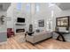 Bright, open-concept living room featuring hardwood floors, a fireplace, and a comfortable seating area at 3538 Akron Ct, Denver, CO 80238