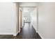 Hardwood floor hallway with view into living room at 9339 Russell Cir, Arvada, CO 80007