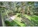 Spacious backyard with mature trees and a patio area for outdoor seating and entertaining at 13955 W 26Th Ave, Golden, CO 80401
