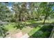 Large backyard featuring mature trees, lush grass, and a peaceful outdoor space at 13955 W 26Th Ave, Golden, CO 80401