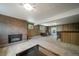 Finished basement features a fireplace, paneled walls, and a bar area perfect for entertaining at 13955 W 26Th Ave, Golden, CO 80401