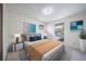Serene bedroom featuring calming artwork, a plush bed, bedside tables, and a view of the outdoors for relaxation at 13955 W 26Th Ave, Golden, CO 80401