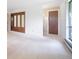 Bedroom featuring soft carpets, a large window, and closet with mirrored doors at 13955 W 26Th Ave, Golden, CO 80401