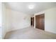 Bright bedroom featuring neutral walls, standard closet, and soft carpeting at 13955 W 26Th Ave, Golden, CO 80401