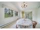 Cozy dining area with large windows, chandelier, and sliding door at 13955 W 26Th Ave, Golden, CO 80401