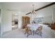 Inviting dining area with ample natural light and a view to the living area at 13955 W 26Th Ave, Golden, CO 80401