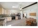 Eat-in kitchen featuring stainless steel appliances, ample cabinet space, and a skylight for abundant natural light at 13955 W 26Th Ave, Golden, CO 80401