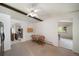 Eat-in kitchen featuring a dining space, a ceiling fan, and access to the sunroom, creating a warm atmosphere at 13955 W 26Th Ave, Golden, CO 80401