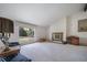 Bright living room with large picture window and classic fireplace at 13955 W 26Th Ave, Golden, CO 80401