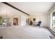 Large open-concept living room with elegant furnishings and dining area at 13955 W 26Th Ave, Golden, CO 80401