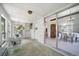 Sunroom featuring access to the backyard and an adjacent dining area, ideal for relaxing and entertaining guests at 13955 W 26Th Ave, Golden, CO 80401