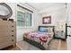 Cozy bedroom with a green bed and southwestern decor at 2115 Hummingbird Way # 103, Georgetown, CO 80444