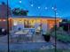Backyard patio features string lights, ample seating, and view of the manicured garden at 9220 Lowell Blvd, Westminster, CO 80031