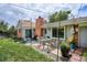 Relaxing backyard area featuring a patio, outdoor seating, string lights, and a well-maintained lawn at 9220 Lowell Blvd, Westminster, CO 80031