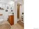Clean bathroom with vanity, shower, framed art and woven storage baskets at 9220 Lowell Blvd, Westminster, CO 80031