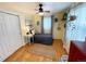 Comfortable bedroom features natural light, hardwood floors, and a ceiling fan at 9220 Lowell Blvd, Westminster, CO 80031