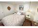 Bedroom featuring a comfortable queen bed, mountain art and modern drop lighting at 9220 Lowell Blvd, Westminster, CO 80031