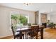 Dining room with a large window overlooking the fenced back yard at 9220 Lowell Blvd, Westminster, CO 80031