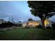 Inviting exterior view of the home at dusk, showcasing the landscaped front yard and cozy ambiance at 9220 Lowell Blvd, Westminster, CO 80031