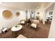 Spacious living room with modern seating, decor and a view into other rooms at 9220 Lowell Blvd, Westminster, CO 80031