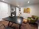 Well-lit home office with a sleek desk, accent chair, and minimalist decor at 9220 Lowell Blvd, Westminster, CO 80031