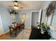 This office features natural light, hardwood floors, a desk, and a ceiling fan at 9220 Lowell Blvd, Westminster, CO 80031