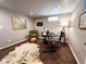Cozy home office space with stylish decor, including unique wall art and a comfortable armchair at 9220 Lowell Blvd, Westminster, CO 80031
