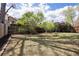 Backyard with lawn, garden beds, and wood fence at 19644 E Girard Dr, Aurora, CO 80013