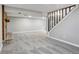 Open basement area with carpeting and stone fireplace at 19644 E Girard Dr, Aurora, CO 80013