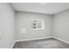 Finished basement space featuring neutral walls, carpeted floors, and a window at 19644 E Girard Dr, Aurora, CO 80013