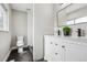 Modern bathroom featuring a double vanity, black marble floors, and tiled shower at 19644 E Girard Dr, Aurora, CO 80013