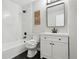 Updated bathroom with black accents, a marble backsplash, and modern fixtures at 19644 E Girard Dr, Aurora, CO 80013