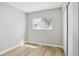Neutral bedroom featuring hardwood floors, a closet, and a window providing natural light at 19644 E Girard Dr, Aurora, CO 80013