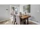 Bright dining area with hardwood floors and sliding glass doors leading to outdoor space at 19644 E Girard Dr, Aurora, CO 80013