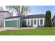 Charming single-Gathering home features green siding, a two-car garage, and a well-maintained lawn at 19644 E Girard Dr, Aurora, CO 80013