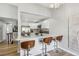 Modern kitchen with white cabinets, marble countertops, and stainless steel appliances at 19644 E Girard Dr, Aurora, CO 80013